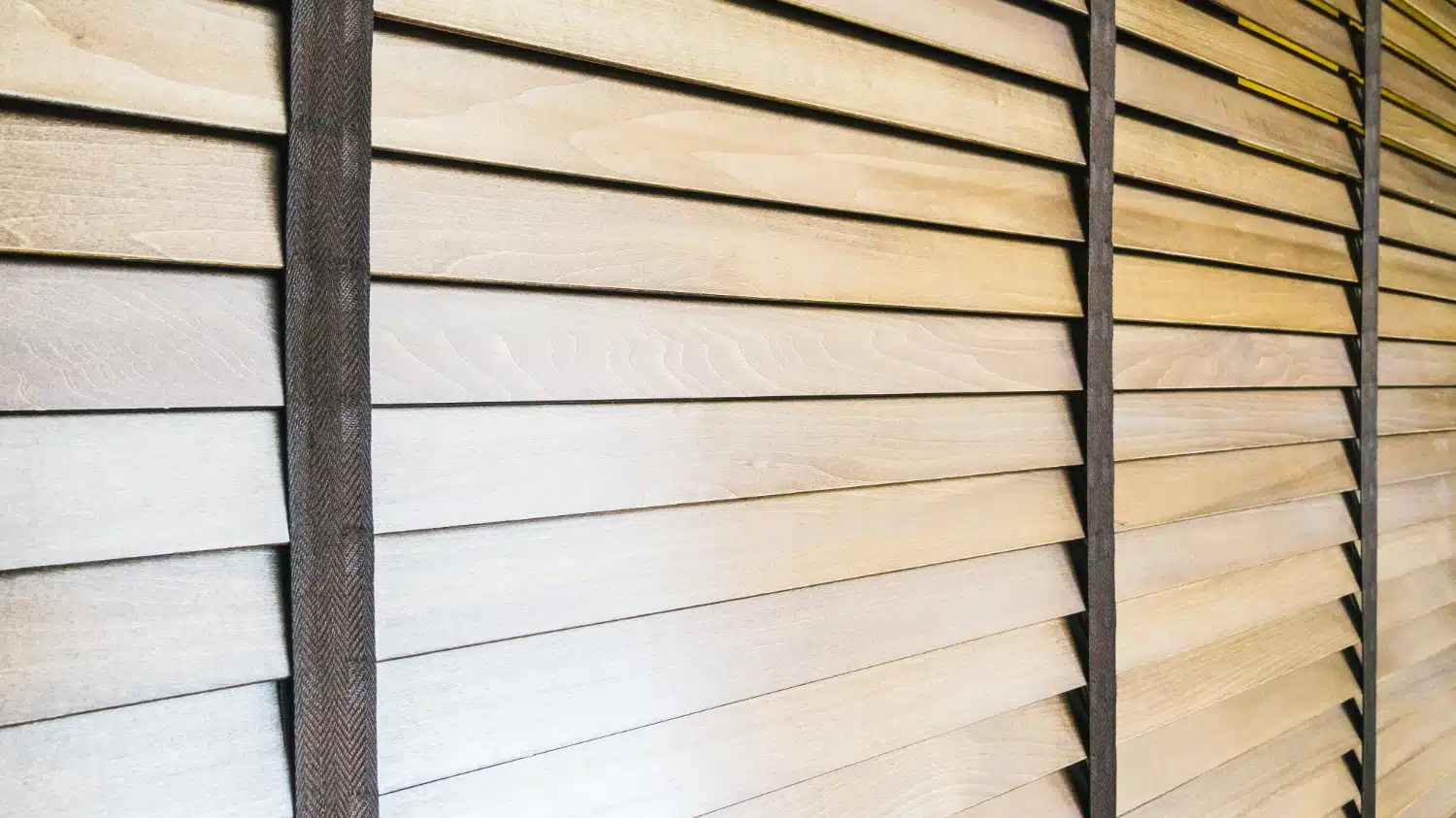 Close-up of closed wooden window blinds.