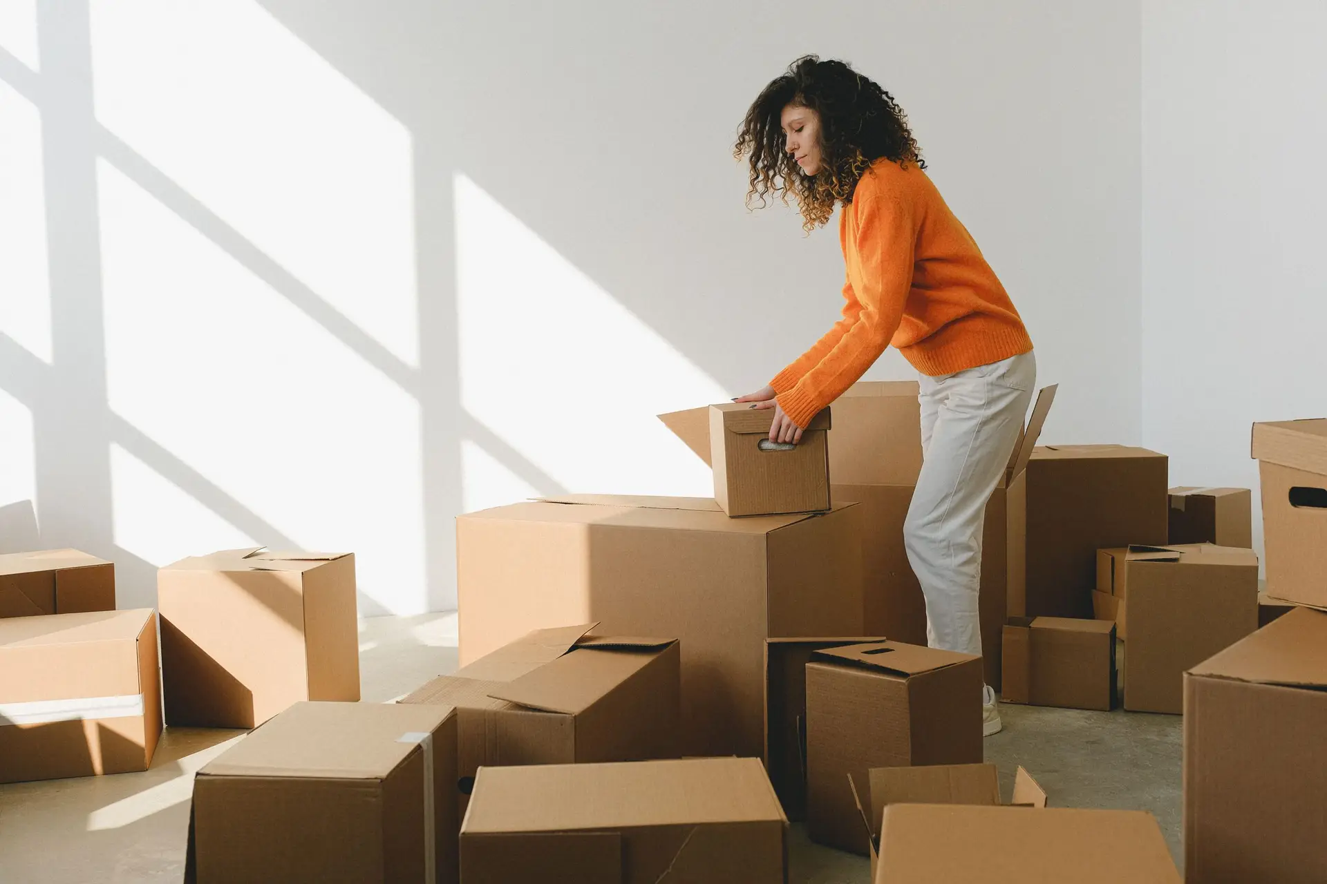 Boxes being packed while clearing out a family home in Dallas Texas
