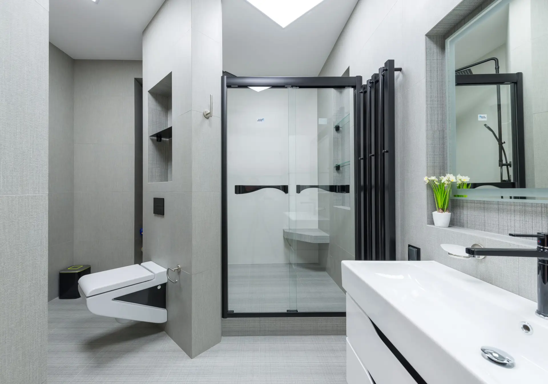 Bright modern bathroom with a spotless glass shower door