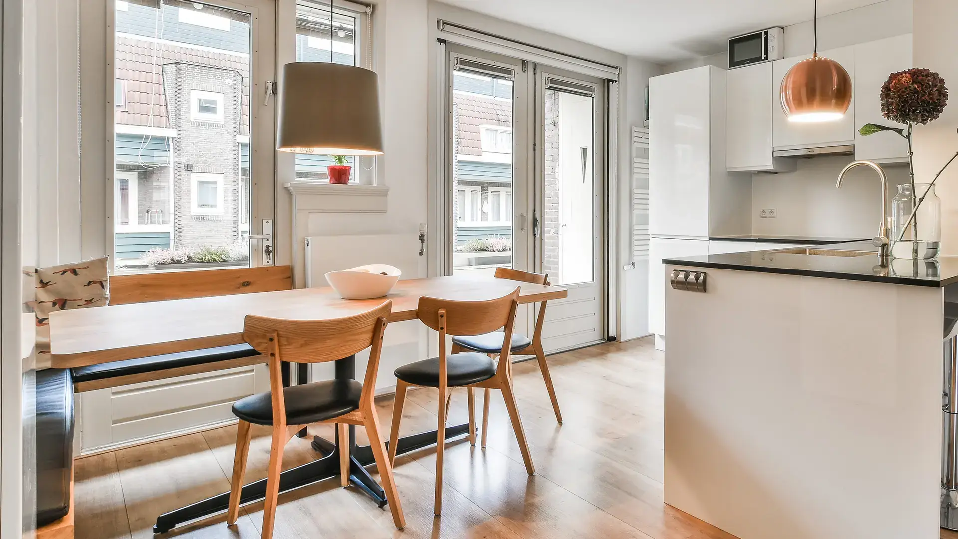 Bright modern dining area with open kitchen