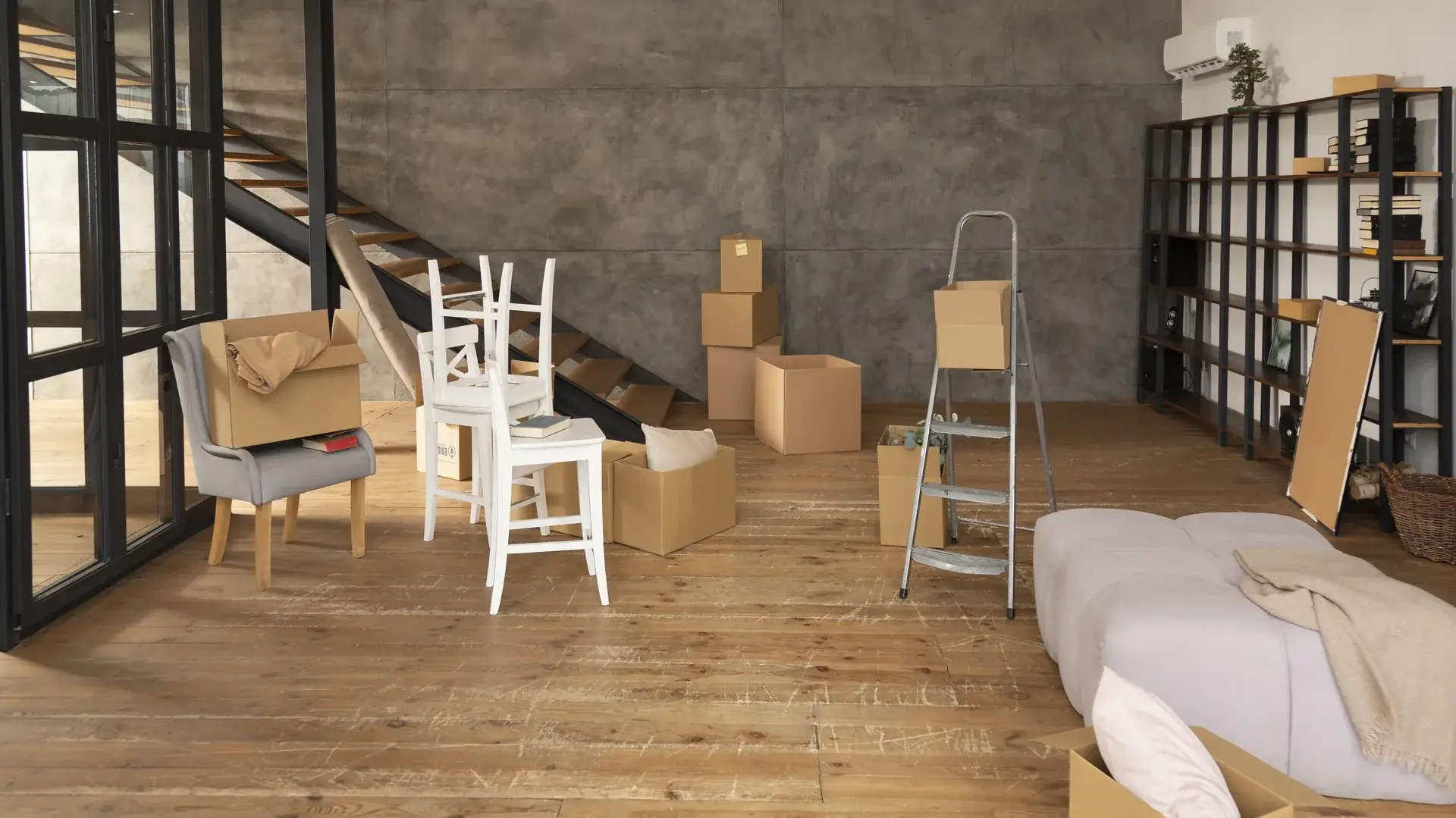 Moving boxes and furniture in basement home
