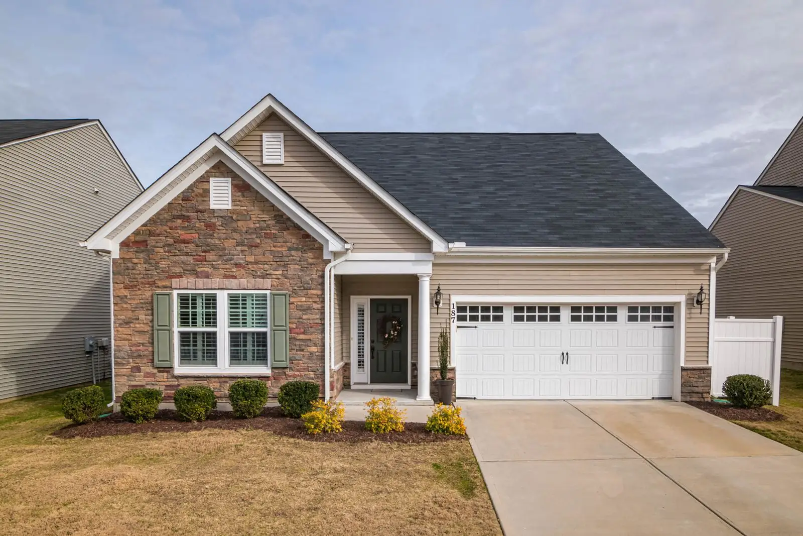 Bright suburban home with a clean garage door and driveway before a move out walkthrough in Melissa TX