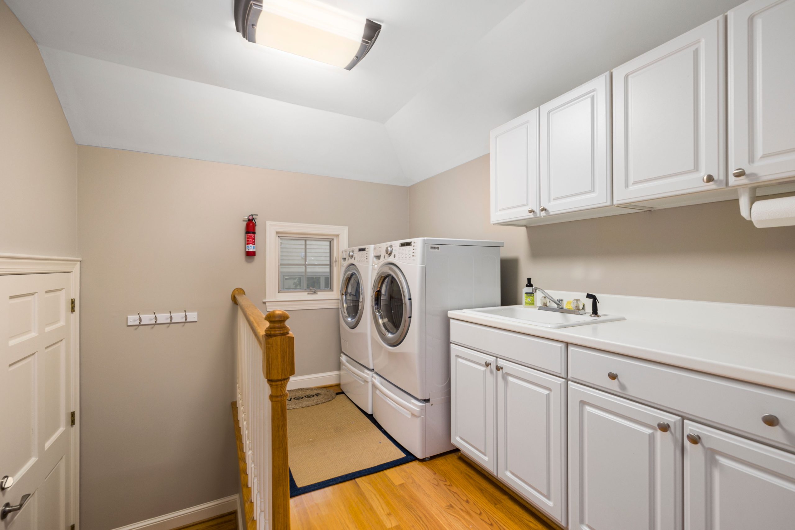 Bright modern laundry room representing laundry as an add on housekeeping service in Westlake TX