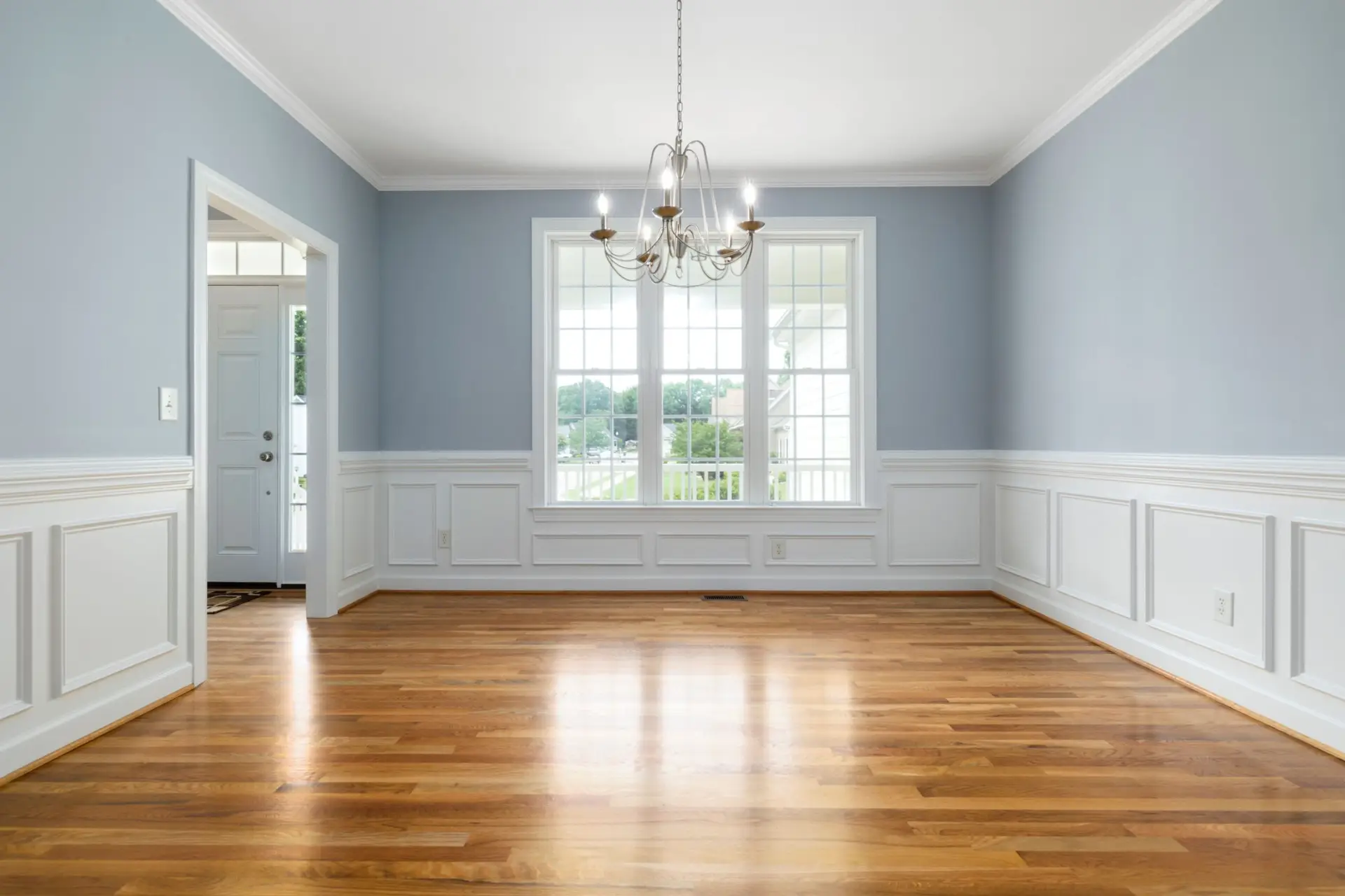 Bright classic room with hardwood floors and wood trim in a historic McKinney TX home