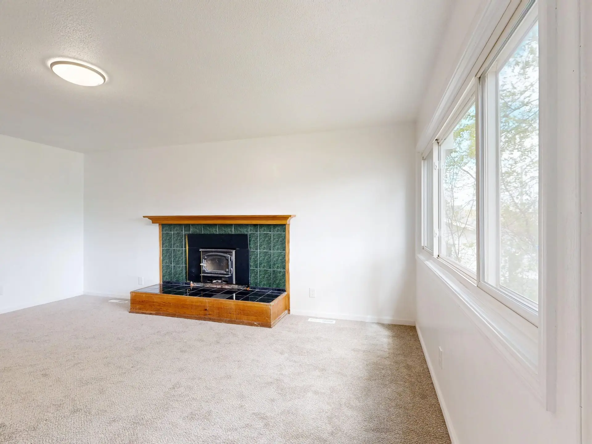 Bright clean living room with fireplace ready for listing photos in McKinney TX