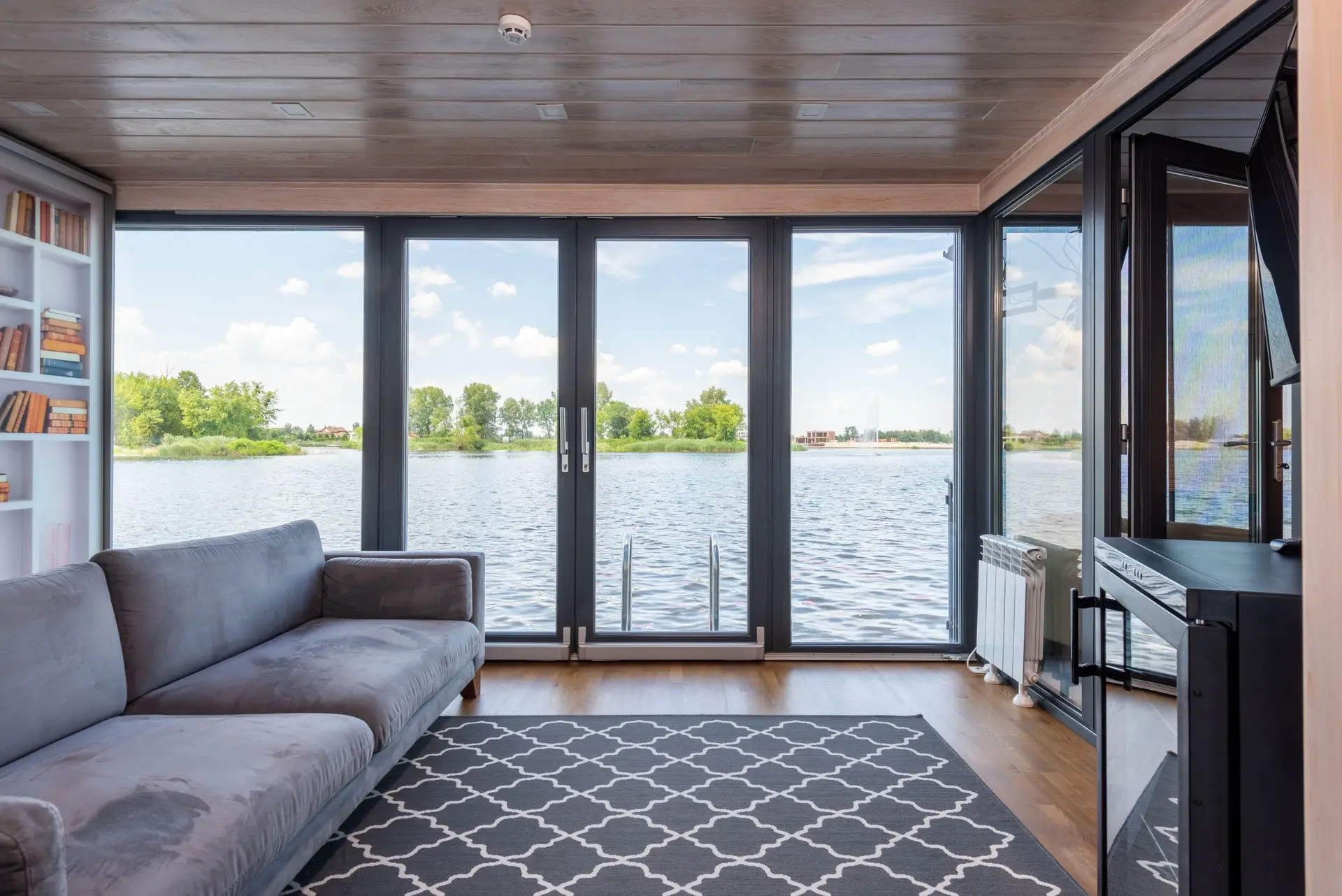 Bright living room with large windows facing the water in a Little Elm TX lake home