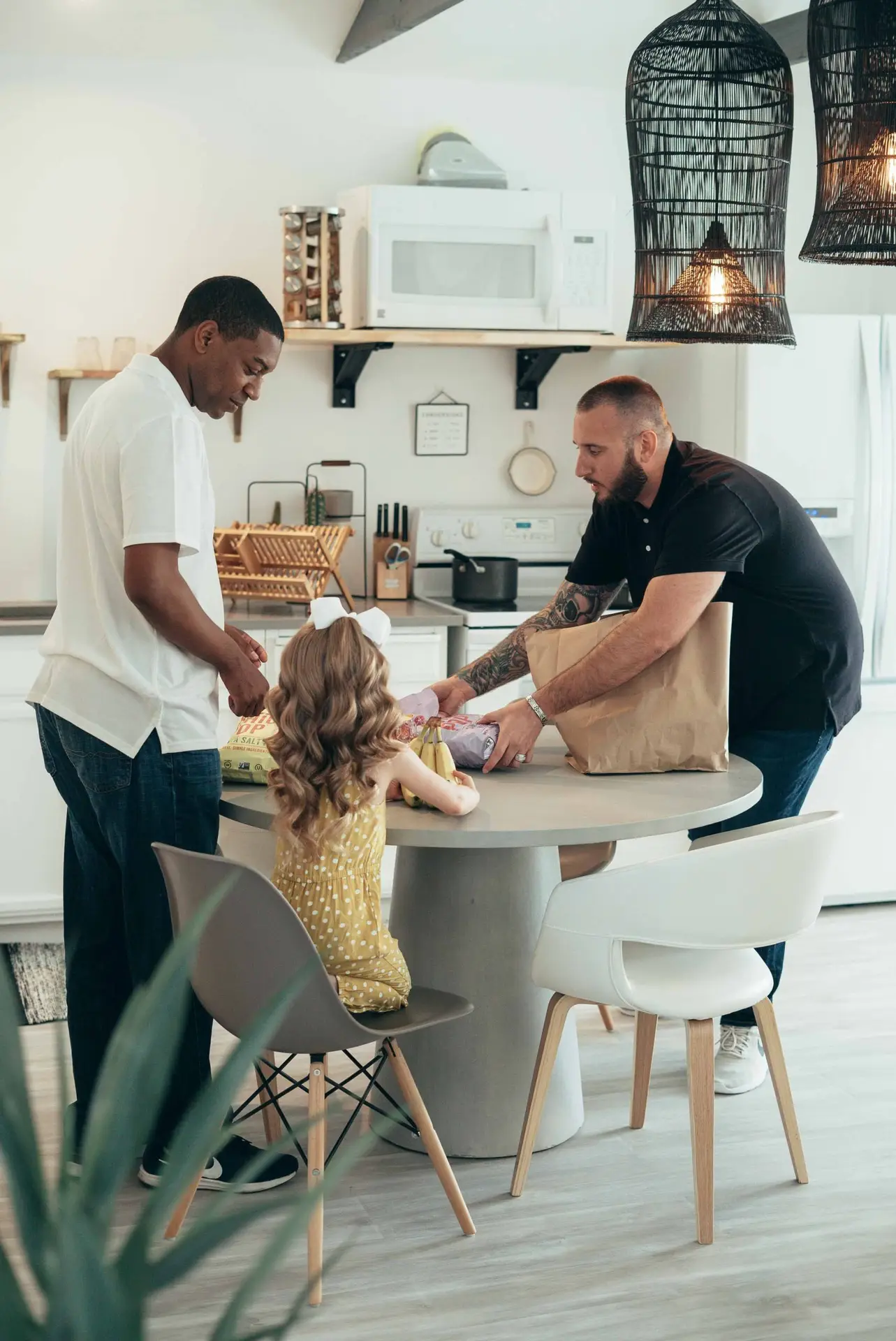 Family gathered in a bright kitchen in a Wylie TX home with a packed weekly schedule