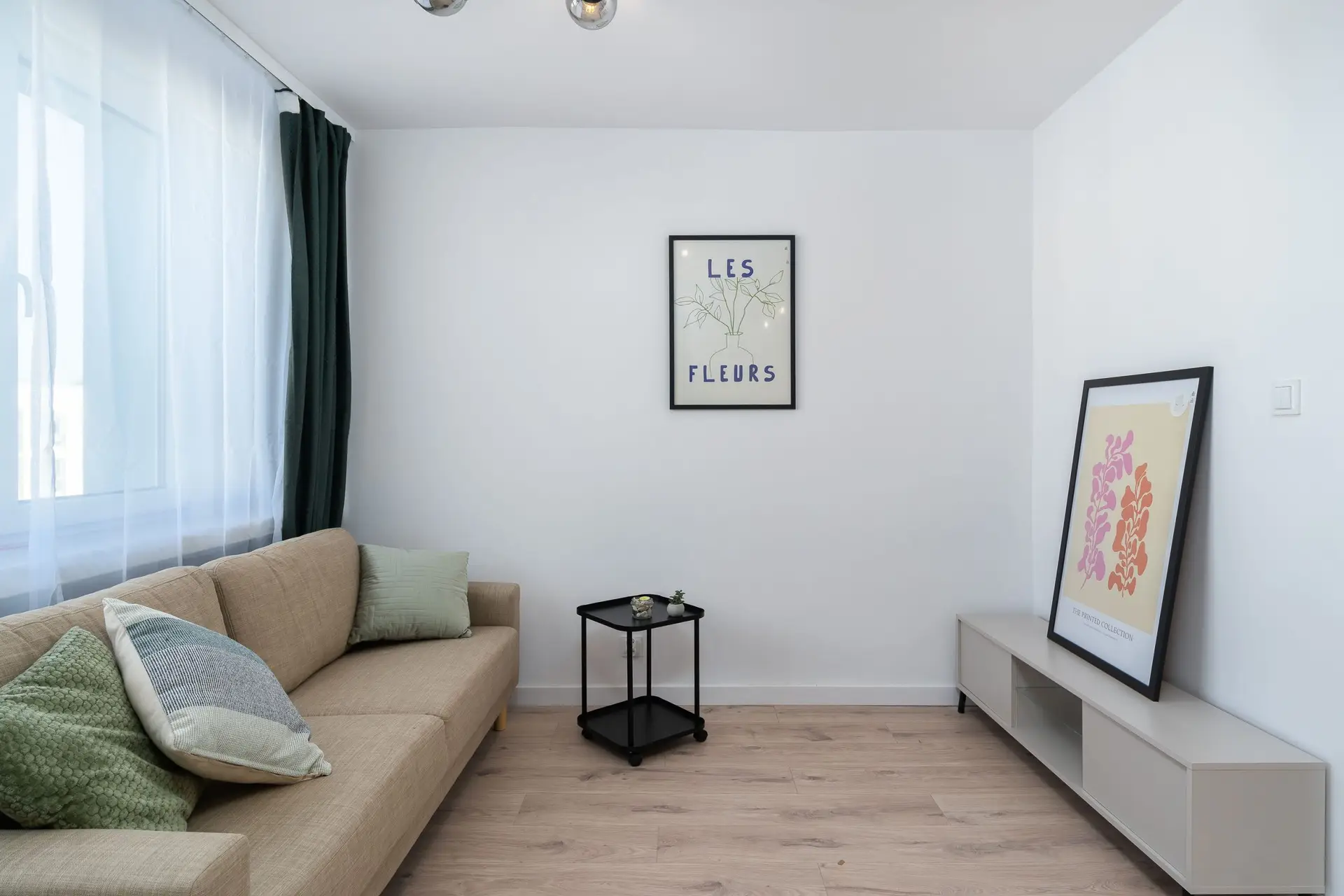 Bright minimalist living room representing a smaller footprint townhome in Murphy TX